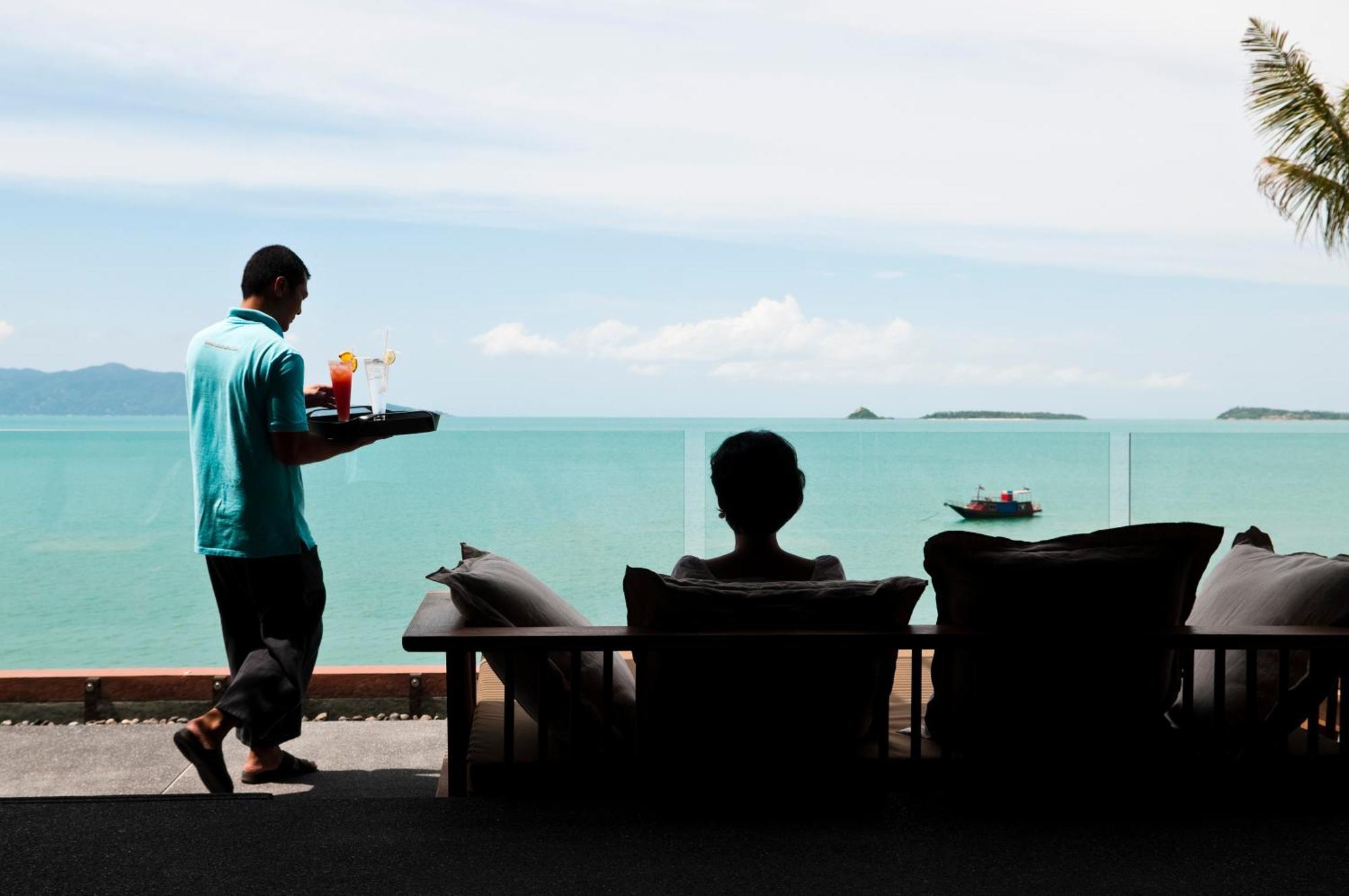 Hansar Samui Resort & Spa - Sha Extra Plus Bophut Exterior photo A waiter serving a guest at a resort